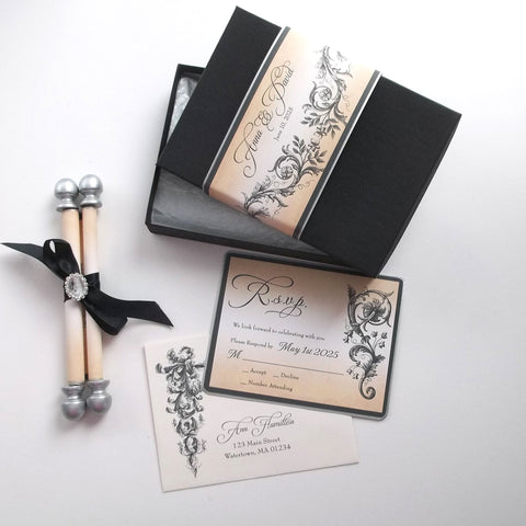 Handmade wedding invitation suite with scroll, RSVP card, packaged in a box with custom printed band. Includes a brooch for the scroll.