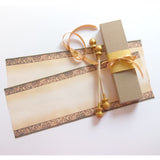 decorative blank scroll with gift box and gold accents
