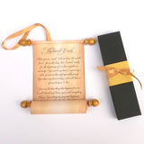 Paper scroll custom printed with text and a black box with a gold ribbon