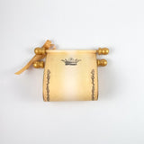 Royal crown and floral border on aged paper scroll, optional gift box