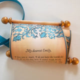 Decorative scroll with turquoise flower garland, custom text