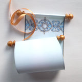 blue and gold paper scroll with decorative design