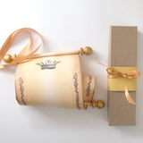 Royal crown and floral border on aged paper scroll, optional gift box