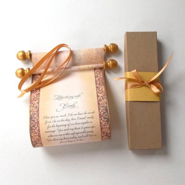 decorative custom printed scroll with gold accents,  and gift box with ribbon.