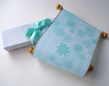 Winter fairytale wedding invitation scrolls with frozen snow flakes, boxed