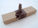 Blank paper scroll for handwritten messages, aged parchment paper with brown accents and kraft box, 5x12" paper